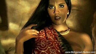 Beautiful brunette Indian dancer seduces with striptease, ripping clothes in teasing softcore scene.