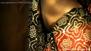 Beautiful brunette Indian dancer seduces with striptease, ripping clothes in teasing softcore scene.