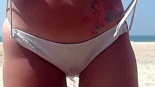 Peeing in White Bikini on Public Beach with Fat Ass