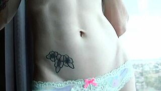 Beautiful blonde transsexual in heels and shoes with tattoo