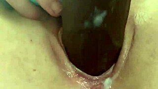 katie bugg passionately fucks herself with a black dick, ripping clothes and masturbating her wet pussy