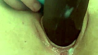 katie bugg passionately fucks herself with a black dick, ripping clothes and masturbating her wet pussy