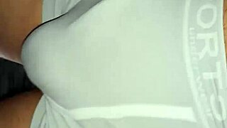 public hardon strains tight shorts in outdoor setting