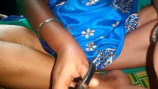 the aunty gives a nice handjob to her boyfriend's cock outdoors. it's an amateur scene with long hair and beautiful tits.