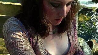 this sweet slender brunette babe fingers her pussy with a vibrator outdoors