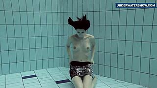 Flashing bright tits underwater in public pool