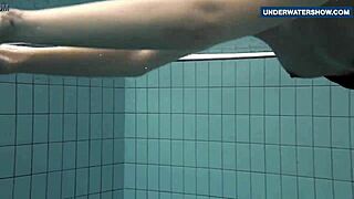 Flashing bright tits underwater in public pool