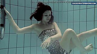 Flashing bright tits underwater in public pool