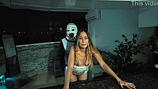 Terrifier bangs Natalia Alvarado under Halloween's spooky moonlight.