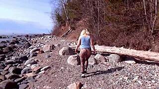 Milf in fishnet pantyhose shows big ass and tits in forest