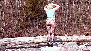 Milf in fishnet pantyhose shows big ass and tits in forest