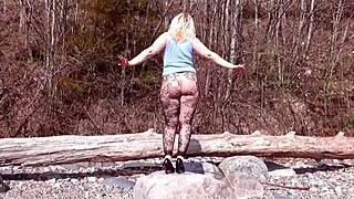 Milf in fishnet pantyhose shows big ass and tits in forest