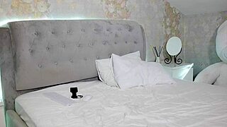 Student with big tits undresses after studying, teasing the camera.