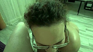 Curly amateur girlfriend cock sucking in POV with glasses