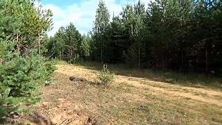 Gorgeous milf walks naked in forest wearing holey pantyhose