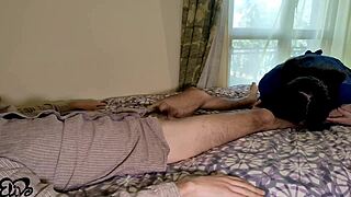 Someone walks another like a dog with handcuffs on