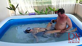 Nudist Regina Noir endures underwater domination with rough sex and blowjob in swimming pool as submissive slave