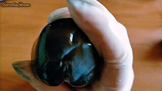 i love how i jerk off this big black dildo wearing my gloves carefully