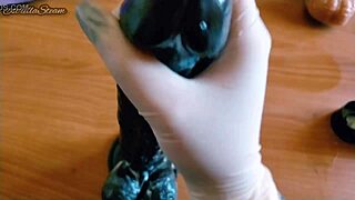 i love how i jerk off this big black dildo wearing my gloves carefully