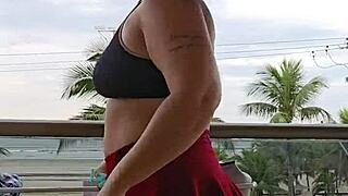 Hey, check out this fun moment showing off the skirt on the balcony in a casual exhibitionist way.