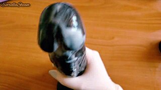 i love how i jerk off this big black dildo wearing my gloves carefully