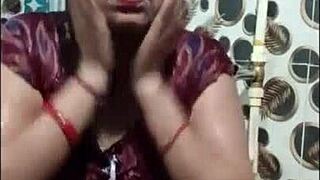 she takes a relaxing shower in her wetlook saree, letting the water soak through the fabric completely