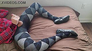 Shemale in plaid dress and argyle tights masturbates solo with fetish crossdressing