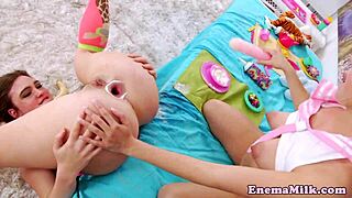 Enema loving lesbian gets toyed in ass with milk squirting toys dildo bizarre fetish mess and trimmed pussy play