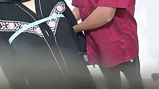 the doctor examined the hijab lady in the hospital as the patient awaited results